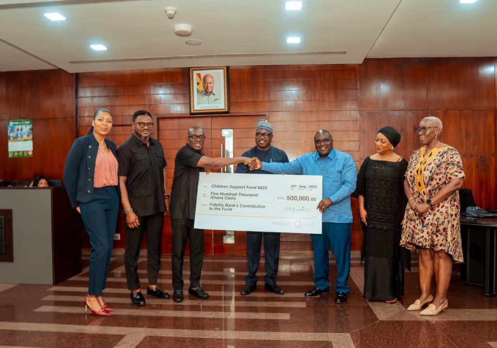 Kwabena Boateng, Deputy Managing Director, Fidelity Bank, handing over the cheque to Chief of Staff Hon. Julius Debrah
